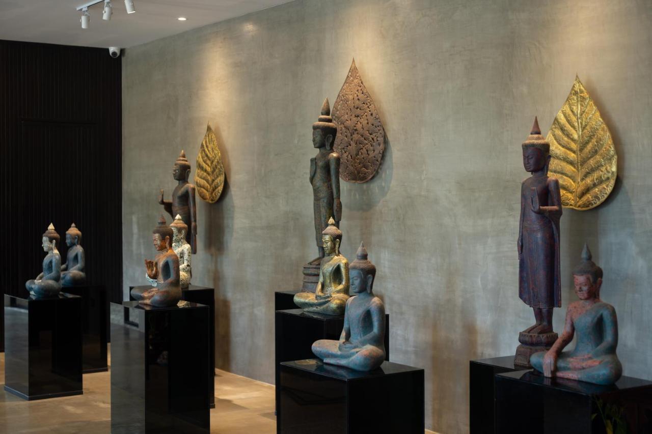 Eightfold Urban Resort Siem Reap Bagian luar foto A collection of Thai and Laotian art